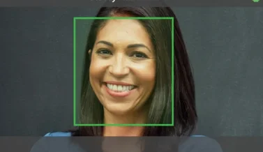 A phone or kiosk screen doing facial recognition clock-in on the forecourt