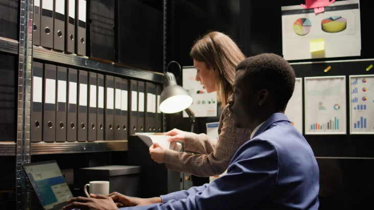 An HR meeting, a signed contract, or a staff file on a desk